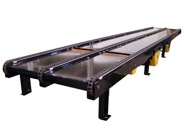 Omni chain conveyor with pop up stops