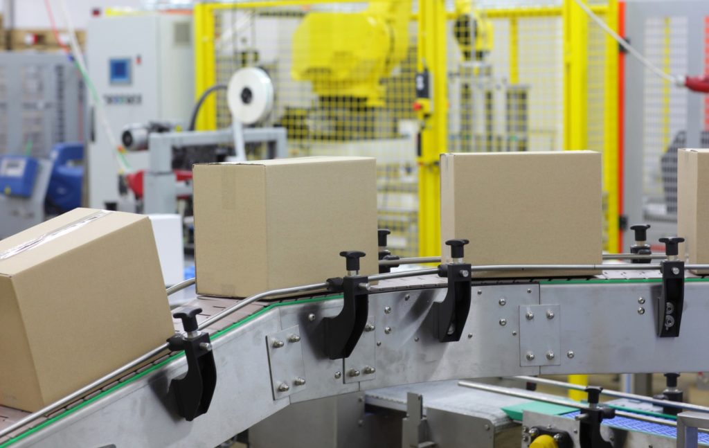 Automation Cardboard boxes on conveyor belt in factory