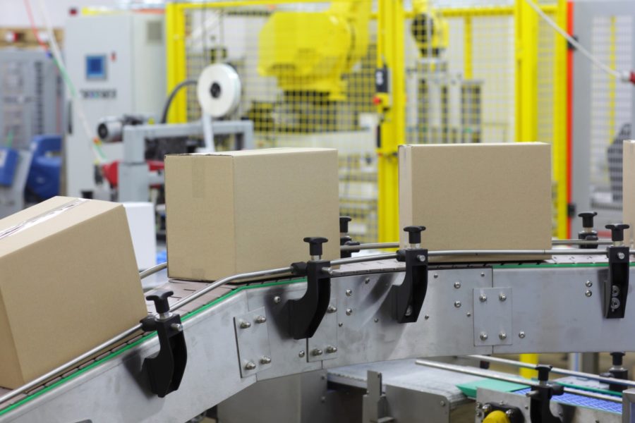 Automation Cardboard boxes on conveyor belt in factory