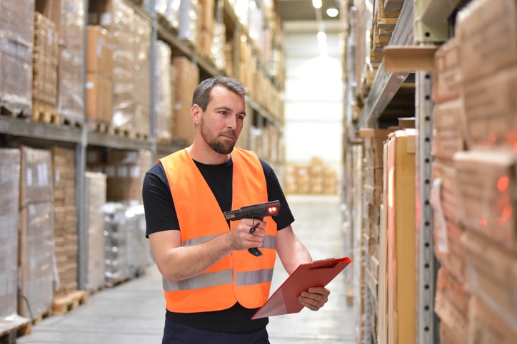 warehouse worker in a warehouse with the barcode scanner